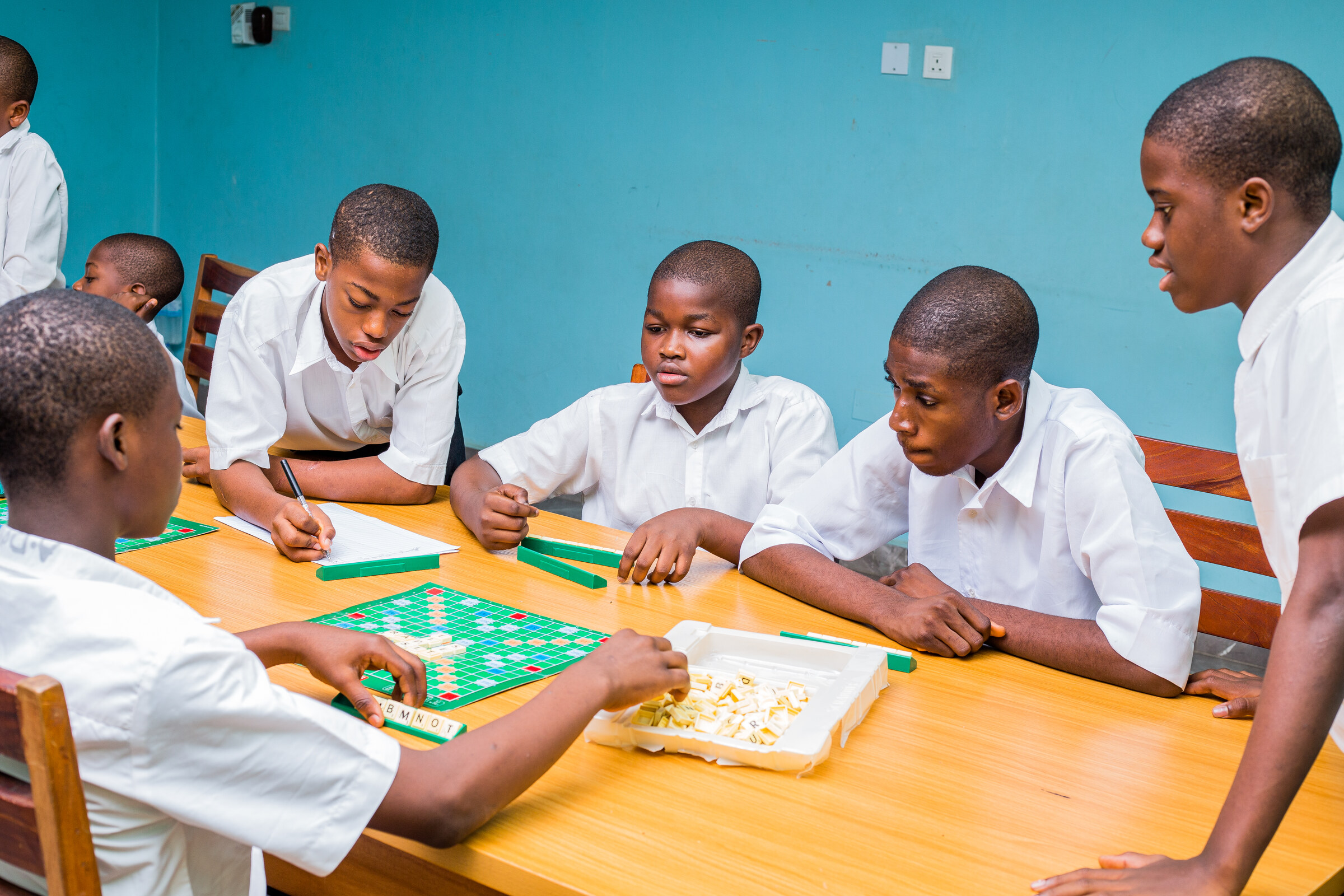 Concord boarding pupils spending time together over a game